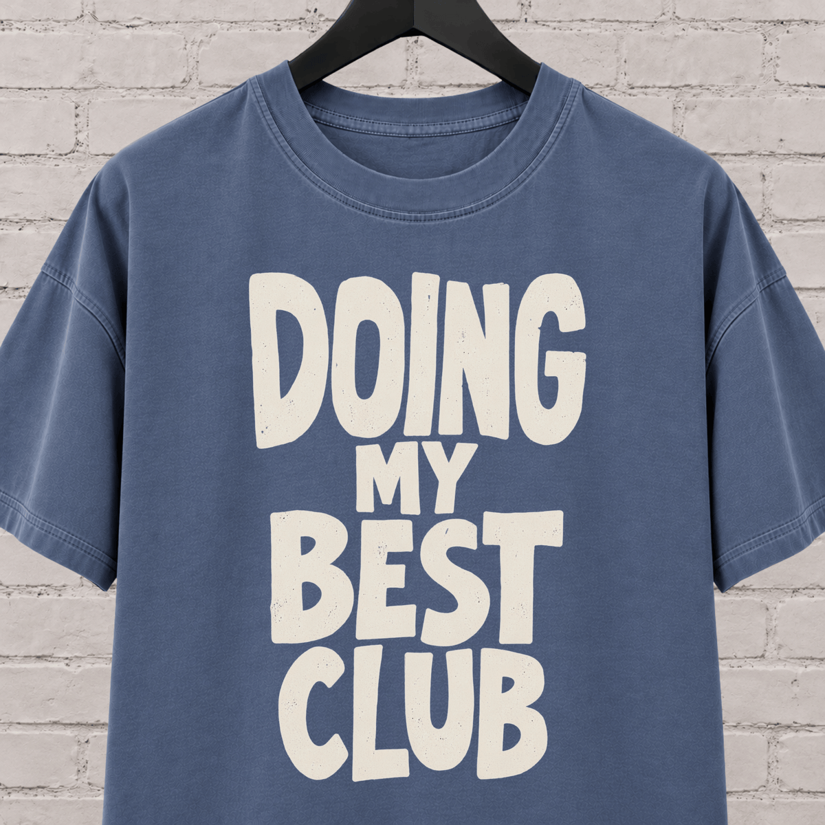 Doing My Best Club graphic T-shirt featuring bold stacked lettering, a low energy humor shirt for overwhelmed days and people running on limited bandwidth.
