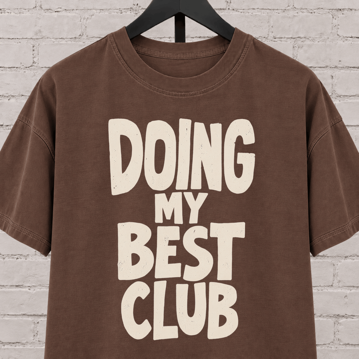 Doing My Best Club graphic T-shirt featuring bold stacked lettering, a low energy humor shirt for overwhelmed days and people running on limited bandwidth.