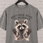 Keep Your Paws to Yourself raccoon graphic T-shirt featuring a raccoon with raised paws, an antisocial personal space shirt.