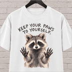 Keep Your Paws to Yourself raccoon graphic T-shirt featuring a raccoon with raised paws, an antisocial personal space shirt.