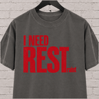 I Need Restraint graphic T-shirt featuring bold distressed lettering, an overwhelmed and overstimulated humor shirt for people who seriously need rest.