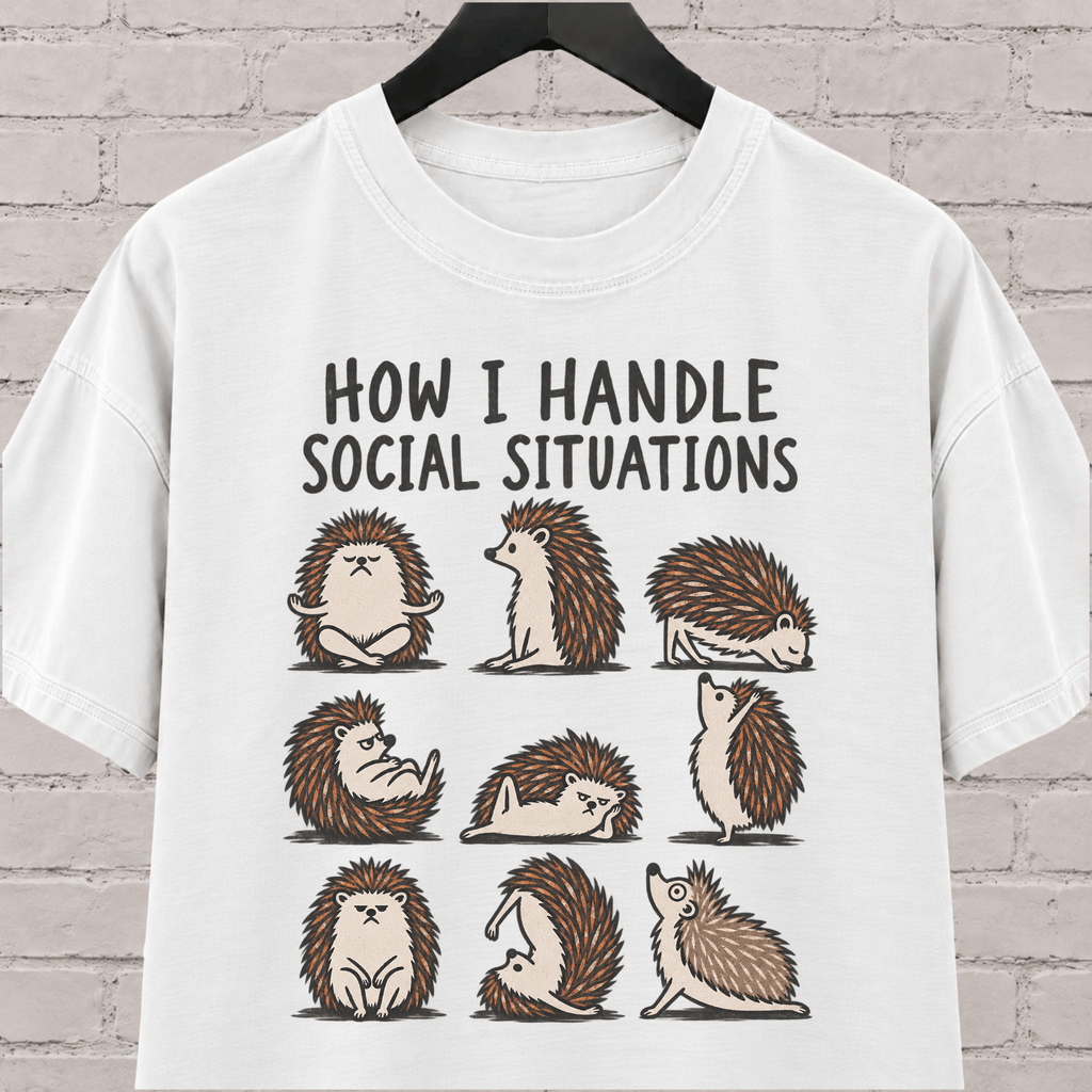 Socially awkward hedgehog graphic T-shirt featuring nine illustrated hedgehogs in different poses with the phrase “How I Handle Social Situations.”