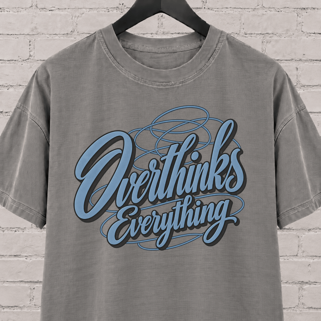 Overthinks Everything graphic T-shirt featuring layered script lettering, an overthinker shirt for people who replay conversations and overanalyze everything.