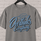 Overthinks Everything graphic T-shirt featuring layered script lettering, an overthinker shirt for people who replay conversations and overanalyze everything.