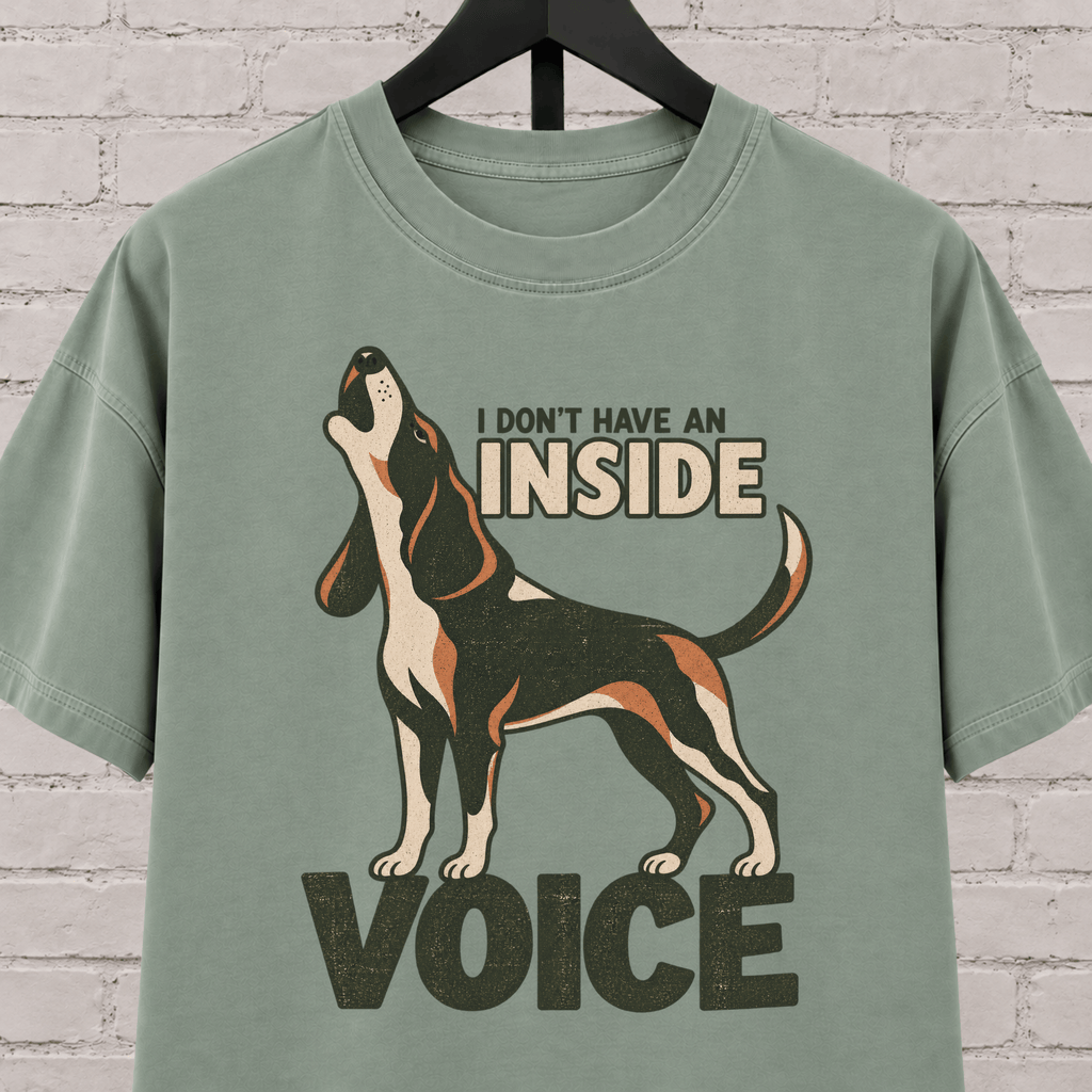 Hound dog graphic T-shirt featuring a howling tricolor hound and the phrase “I Don’t Have an Inside Voice,” a dog lover shirt with loud dog humor.