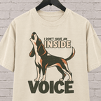 Hound dog graphic T-shirt featuring a howling tricolor hound and the phrase “I Don’t Have an Inside Voice,” a dog lover shirt with loud dog humor.