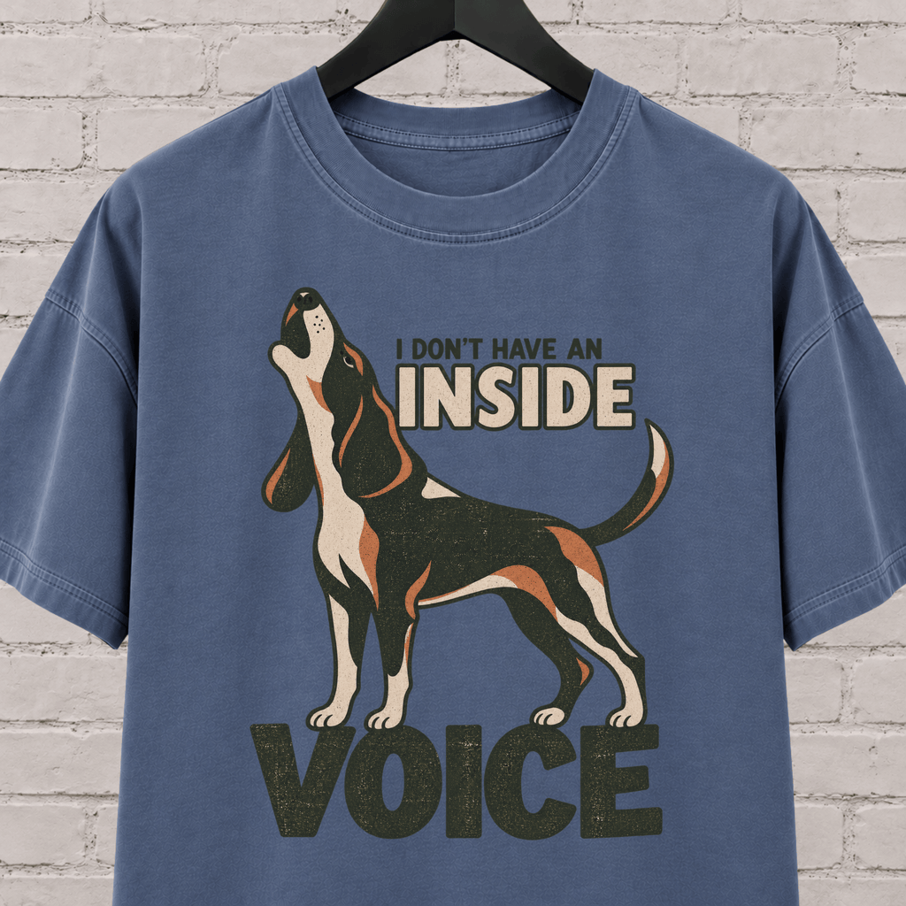 Hound dog graphic T-shirt featuring a howling tricolor hound and the phrase “I Don’t Have an Inside Voice,” a dog lover shirt with loud dog humor.